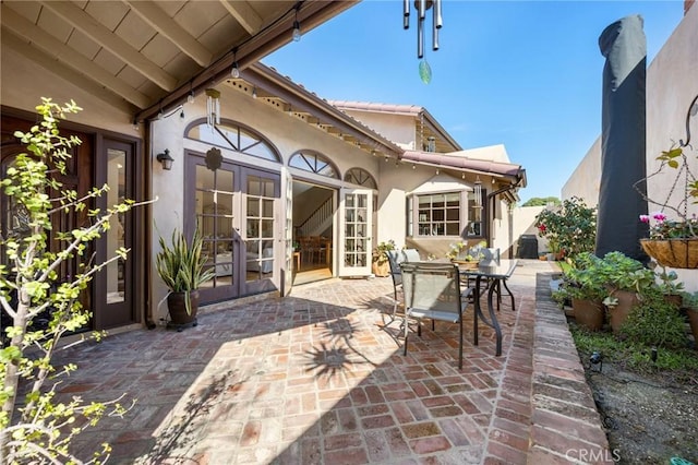 view of patio featuring outdoor dining space and french doors