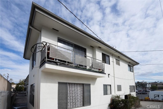 view of building exterior with fence