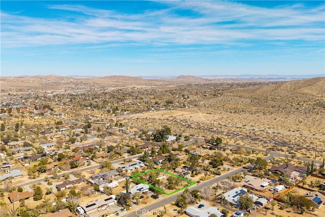 bird's eye view with a mountain view and a desert view