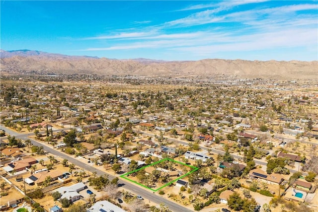 birds eye view of property with a residential view, a desert view, and a mountain view