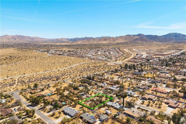 aerial view featuring a mountain view and a desert view