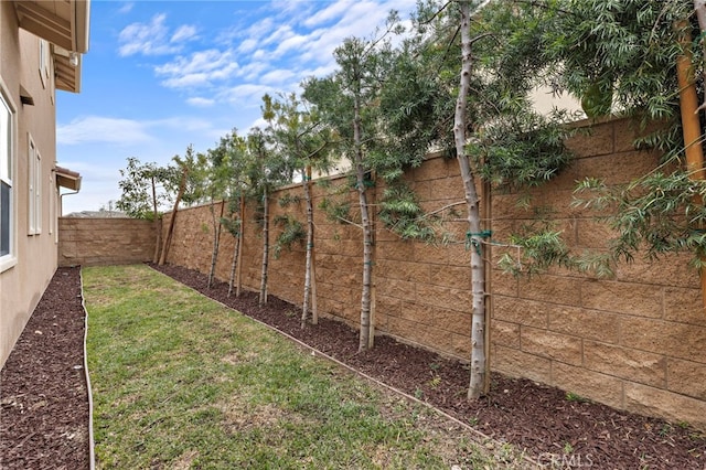 view of yard featuring a fenced backyard