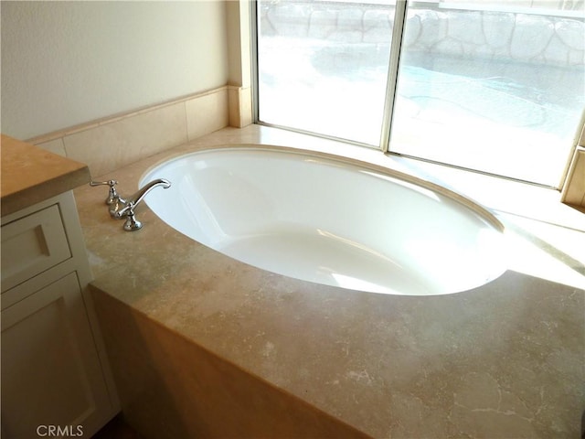 bathroom with a garden tub