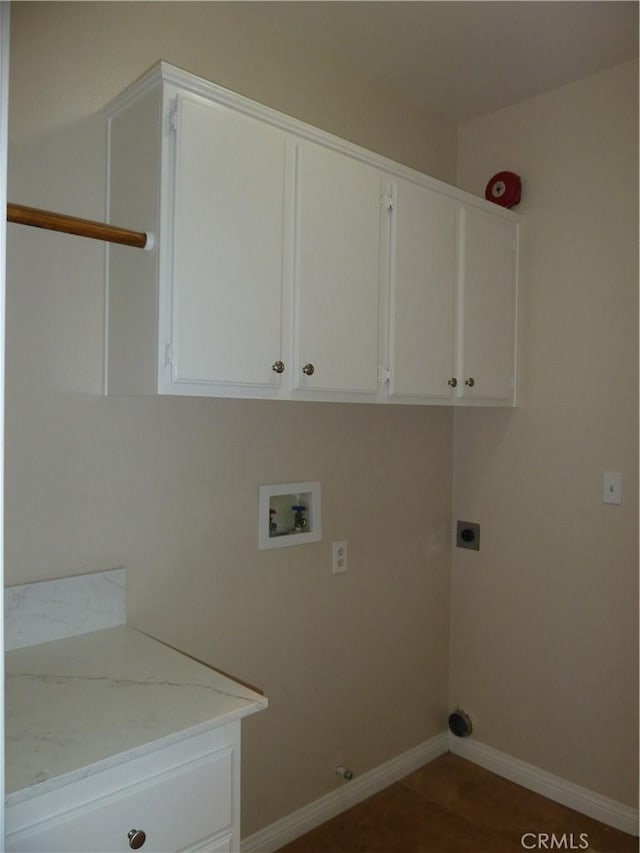 washroom featuring baseboards, hookup for a washing machine, cabinet space, and electric dryer hookup