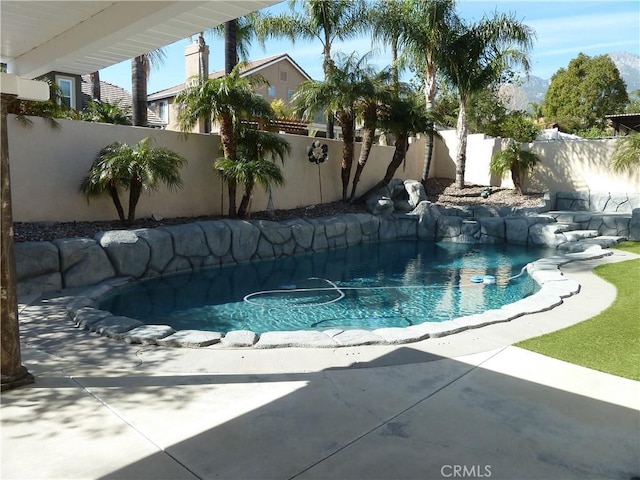 view of swimming pool with a fenced backyard and a fenced in pool