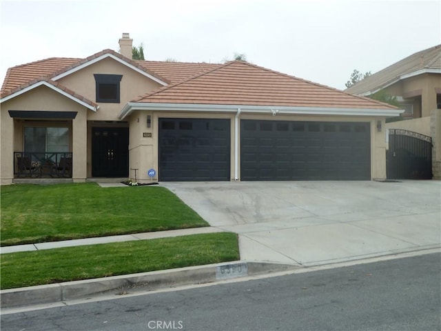 ranch-style home featuring an attached garage, driveway, stucco siding, a front lawn, and a chimney