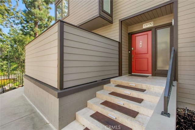 property entrance featuring fence