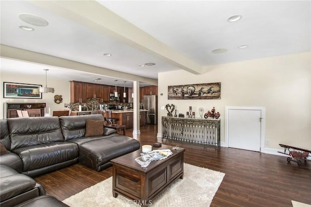 living room featuring dark wood-type flooring, beamed ceiling, recessed lighting, and baseboards