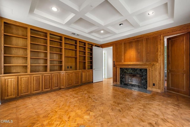 unfurnished living room featuring a fireplace, recessed lighting, visible vents, coffered ceiling, and beamed ceiling