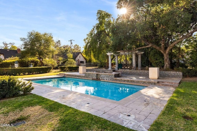 outdoor pool with a patio area and a pergola