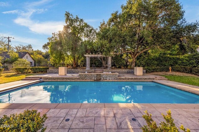 508 W Eucalyptus St, Ojai, CA 93023 - outdoor pool with a patio and view of wooded area