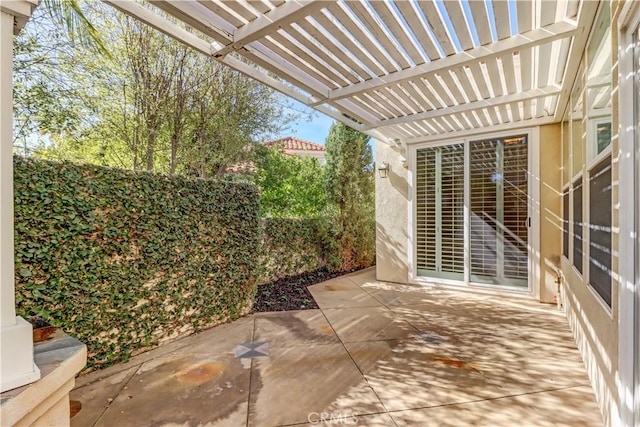 view of patio with fence and a pergola