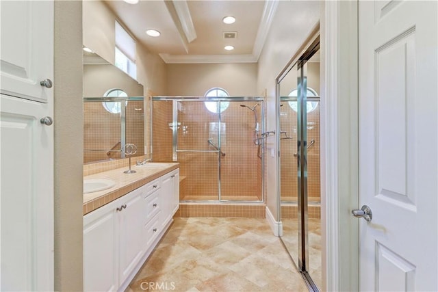 bathroom with crown molding, double vanity, recessed lighting, a sink, and a shower stall