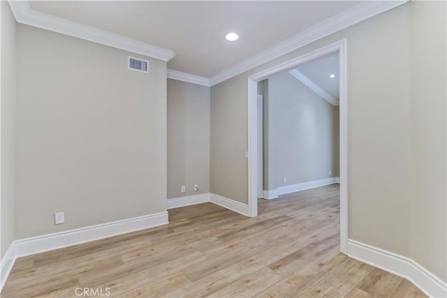 empty room featuring crown molding, recessed lighting, visible vents, light wood-style flooring, and baseboards