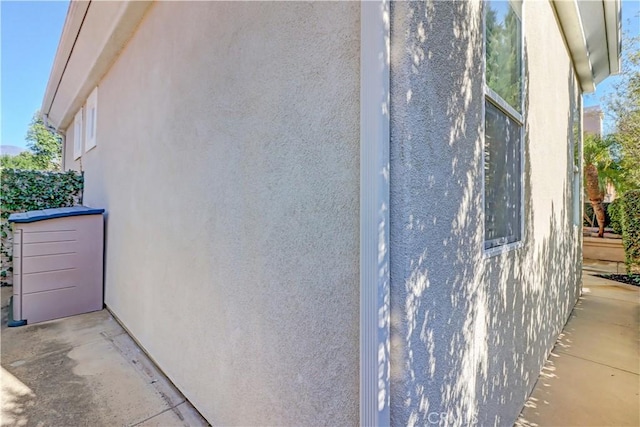 view of side of home featuring stucco siding