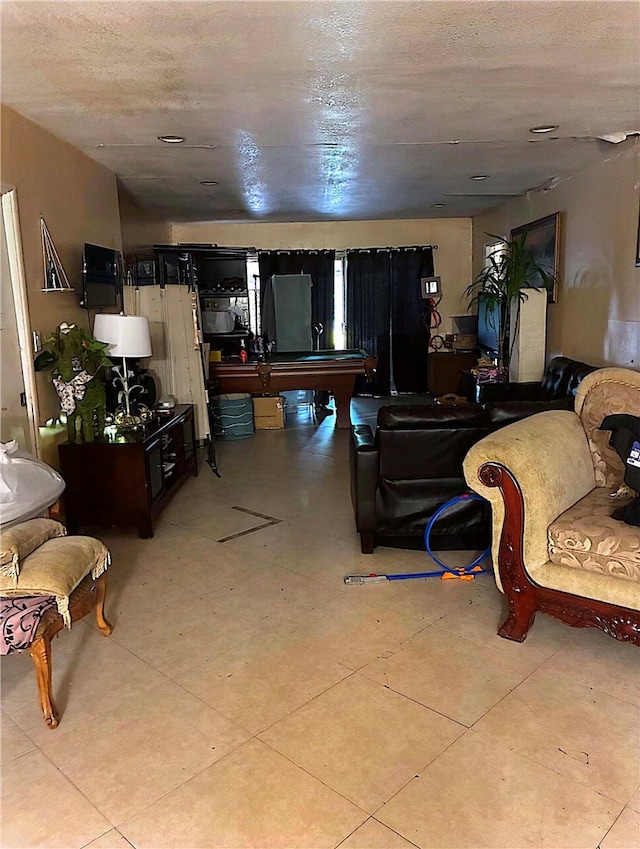 living area with a textured ceiling