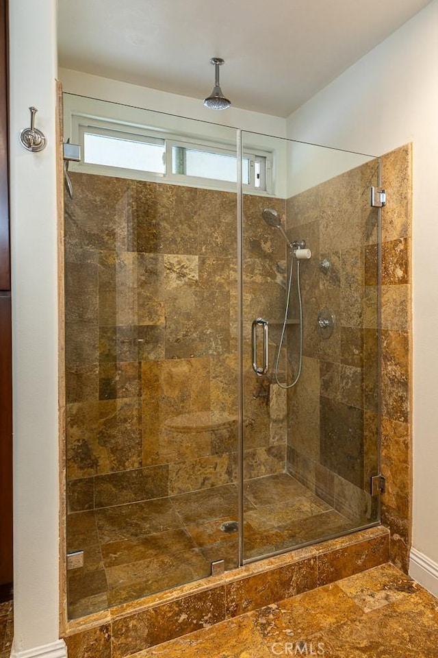 full bathroom with a shower stall