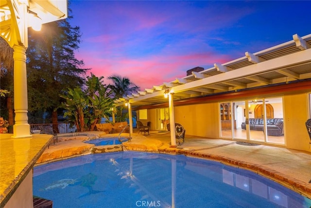 outdoor pool featuring an in ground hot tub, a patio, and a pergola