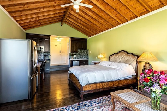 bedroom with vaulted ceiling with beams, dark wood finished floors, a ceiling fan, freestanding refrigerator, and wood ceiling