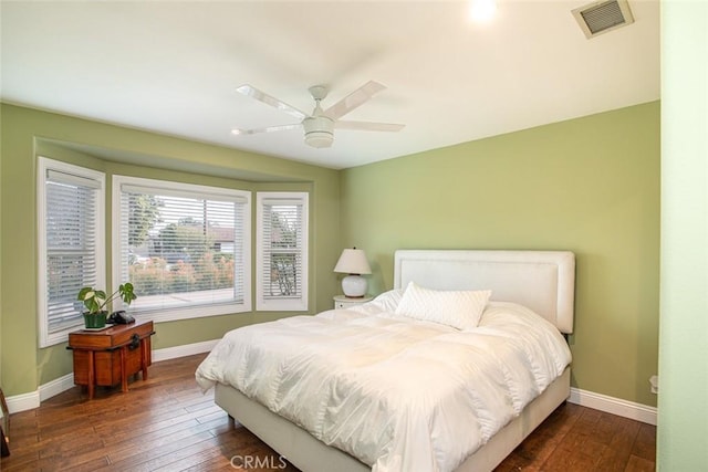 bedroom featuring hardwood / wood-style flooring, baseboards, and visible vents