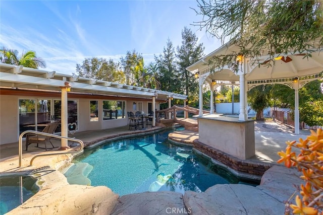 pool featuring a patio area and fence