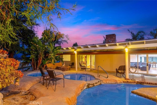 pool at dusk with french doors, an outdoor hangout area, a patio area, an in ground hot tub, and an outdoor pool