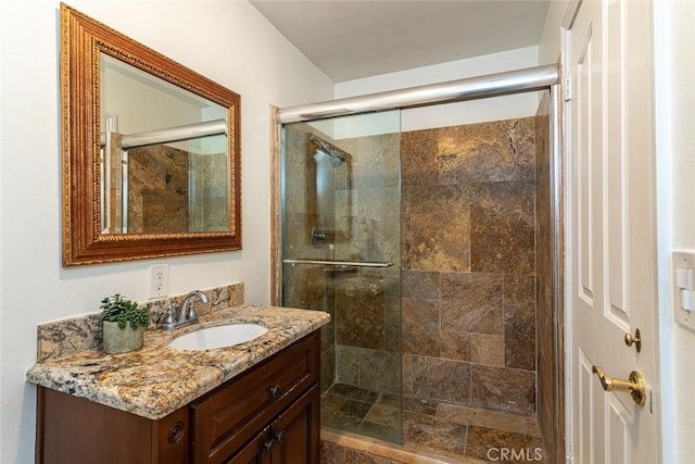 full bathroom featuring a shower stall and vanity