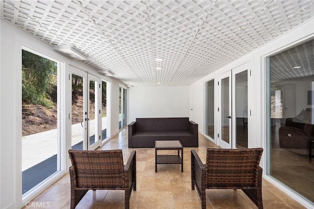 sunroom featuring french doors