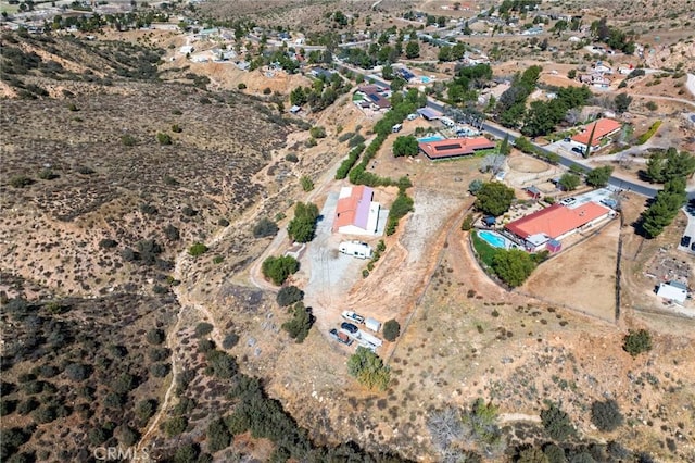 drone / aerial view with view of desert