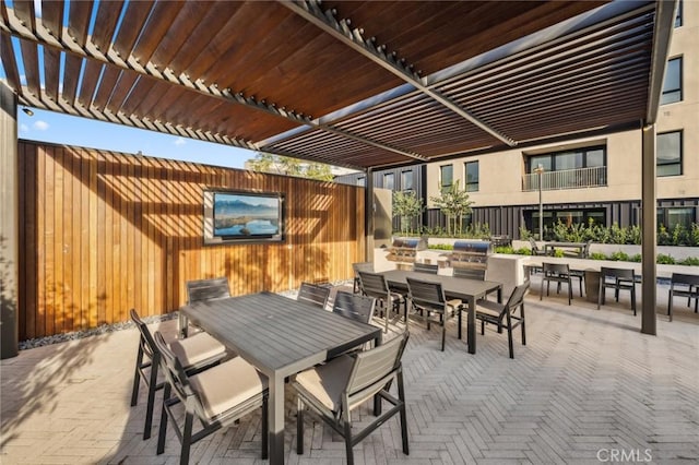 view of patio / terrace featuring outdoor dining space and a pergola