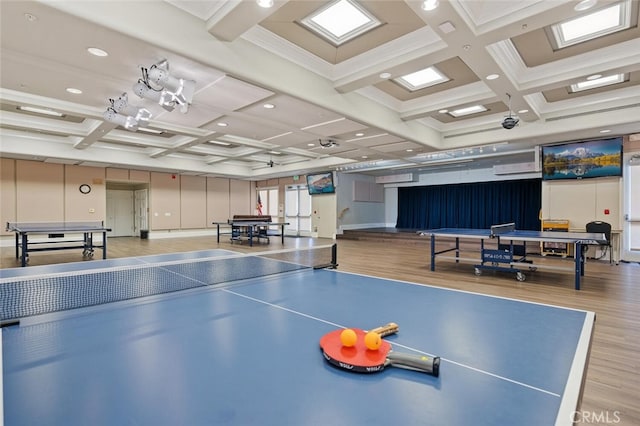 rec room with coffered ceiling, beam ceiling, and wood finished floors