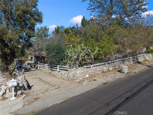 view of front of property featuring fence