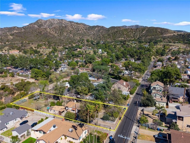 birds eye view of property featuring a mountain view and a residential view