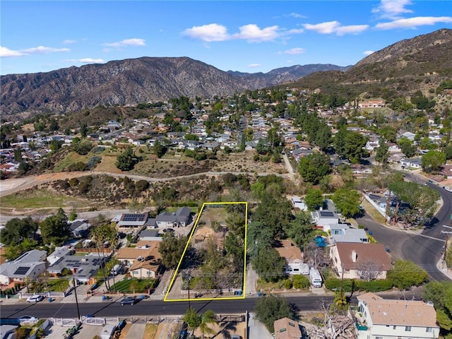 drone / aerial view with a residential view and a mountain view