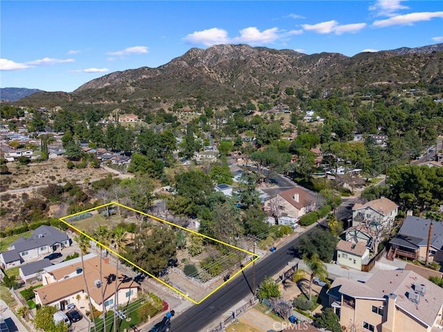 drone / aerial view with a residential view and a mountain view