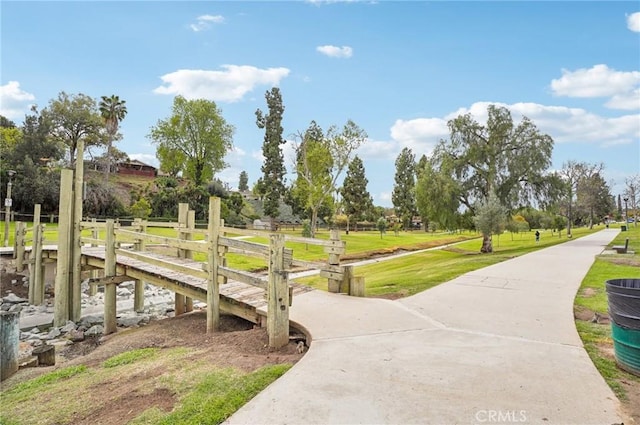 view of property's community featuring a lawn