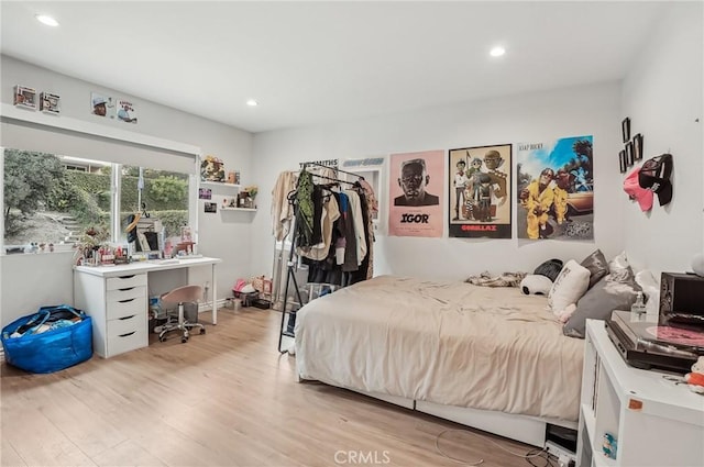 bedroom featuring recessed lighting and light wood finished floors