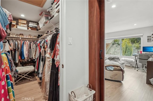 spacious closet with wood finished floors