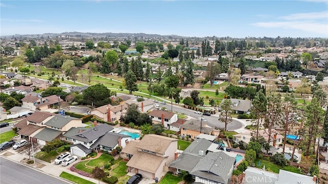 birds eye view of property with a residential view