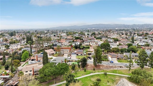 drone / aerial view with a residential view and a mountain view