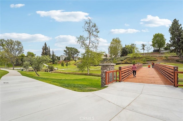 view of home's community featuring a lawn