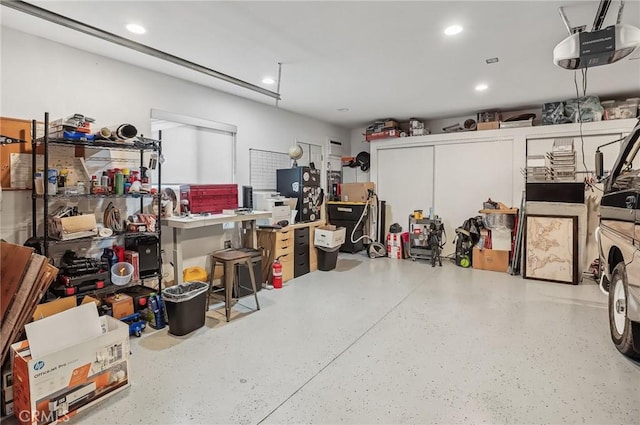 garage featuring a garage door opener and recessed lighting