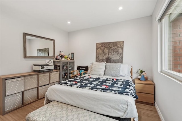 bedroom featuring recessed lighting, baseboards, and wood finished floors