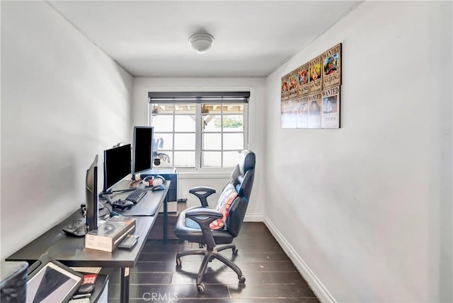 office space with baseboards and wood finished floors