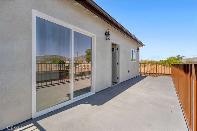 view of patio featuring fence