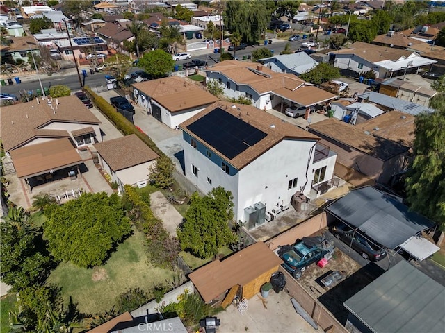 birds eye view of property with a residential view