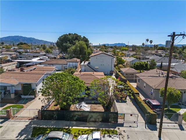 birds eye view of property featuring a mountain view and a residential view