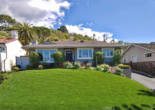 ranch-style home with a front yard