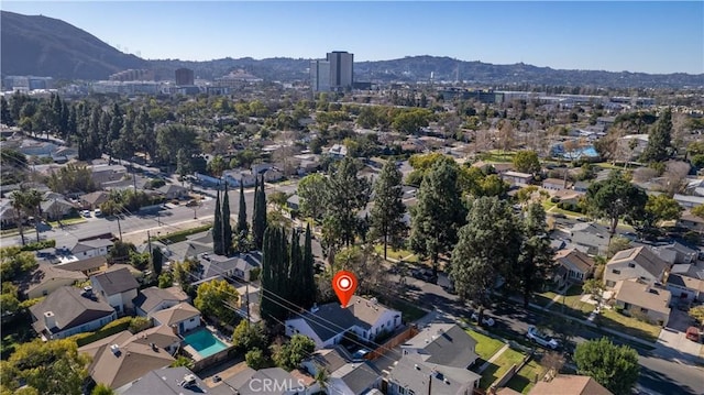 birds eye view of property with a mountain view