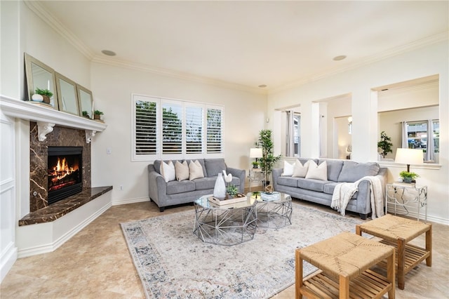 living room featuring ornamental molding, a high end fireplace, and baseboards